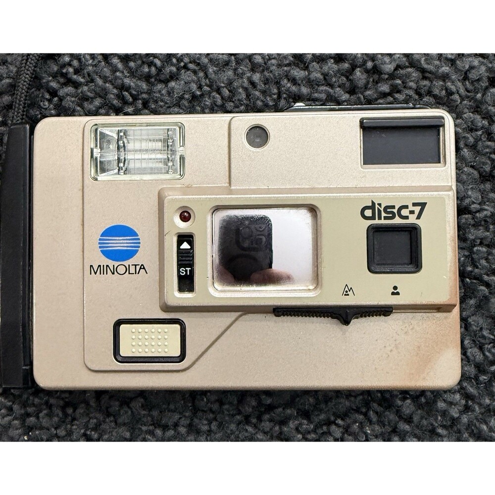 1983 Minolta Disc-7 Selfie Mirror Compact Disc Film Camera
